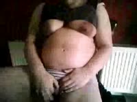 Fat pregnant mom pleasures herself by rubbing her wet pussy 